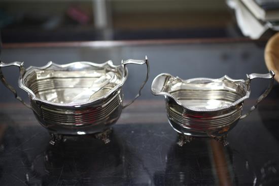 A late Victorian matched four piece silver tea and coffee set and pair of tongs, gross 63.5 oz.